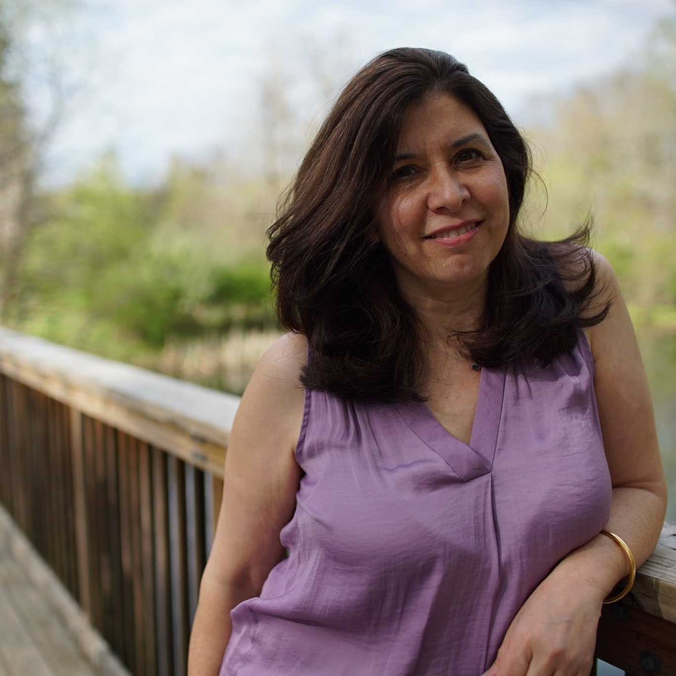 Photo of Dana Alan on a bridge