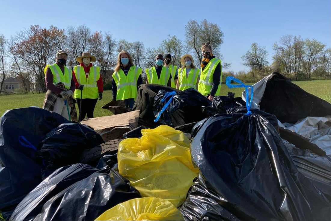 People tending to young trees