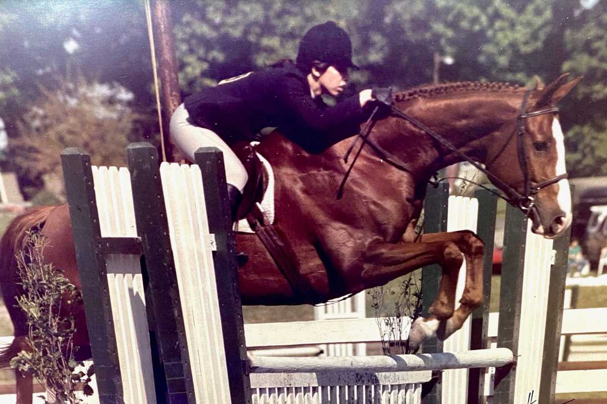 Dana with one of her first horses, Indiscrete "Chester", riding at Ludwig's